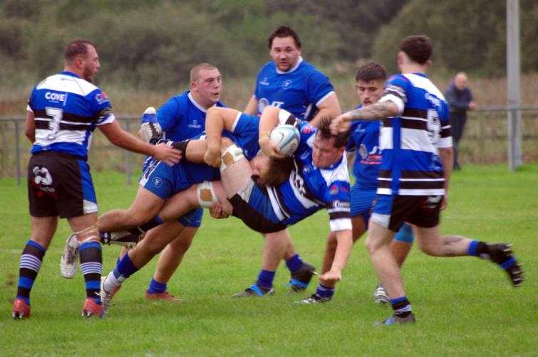 Blues centre Iestyn Arnold puts in a big tackle